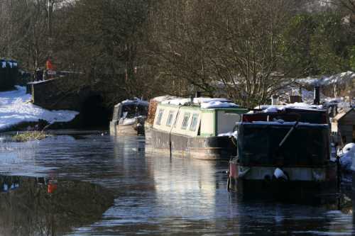 Narrowboats on the canal, in snow and ice