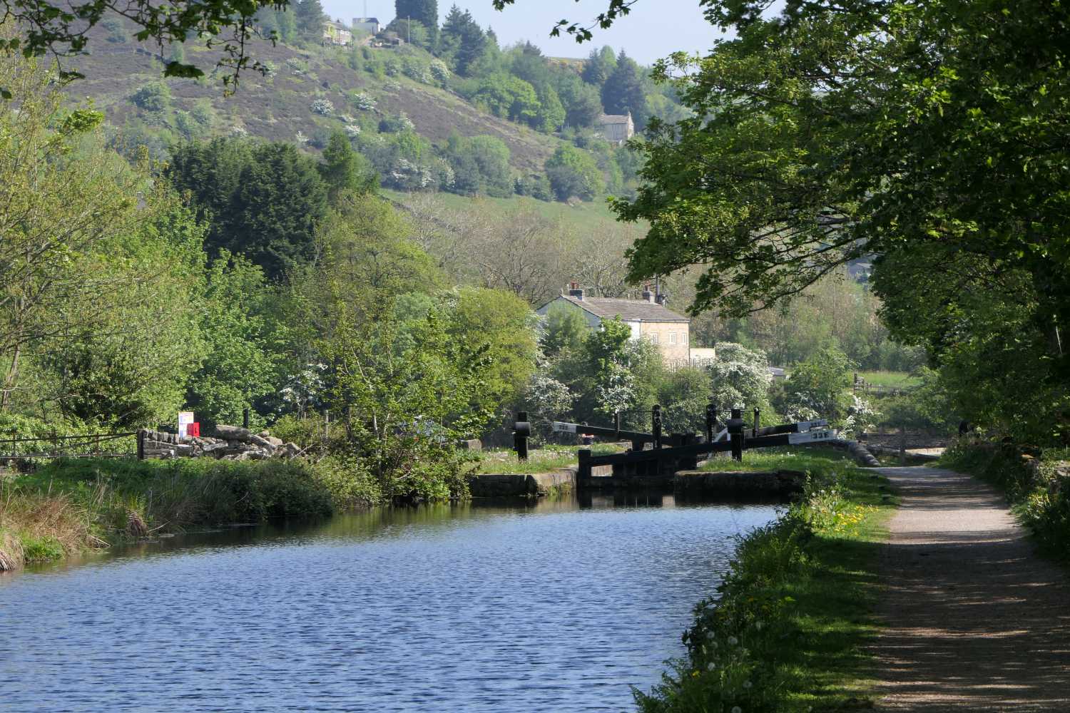 Sunny view towards lock 33E of the Huddersfield Narrow canal.