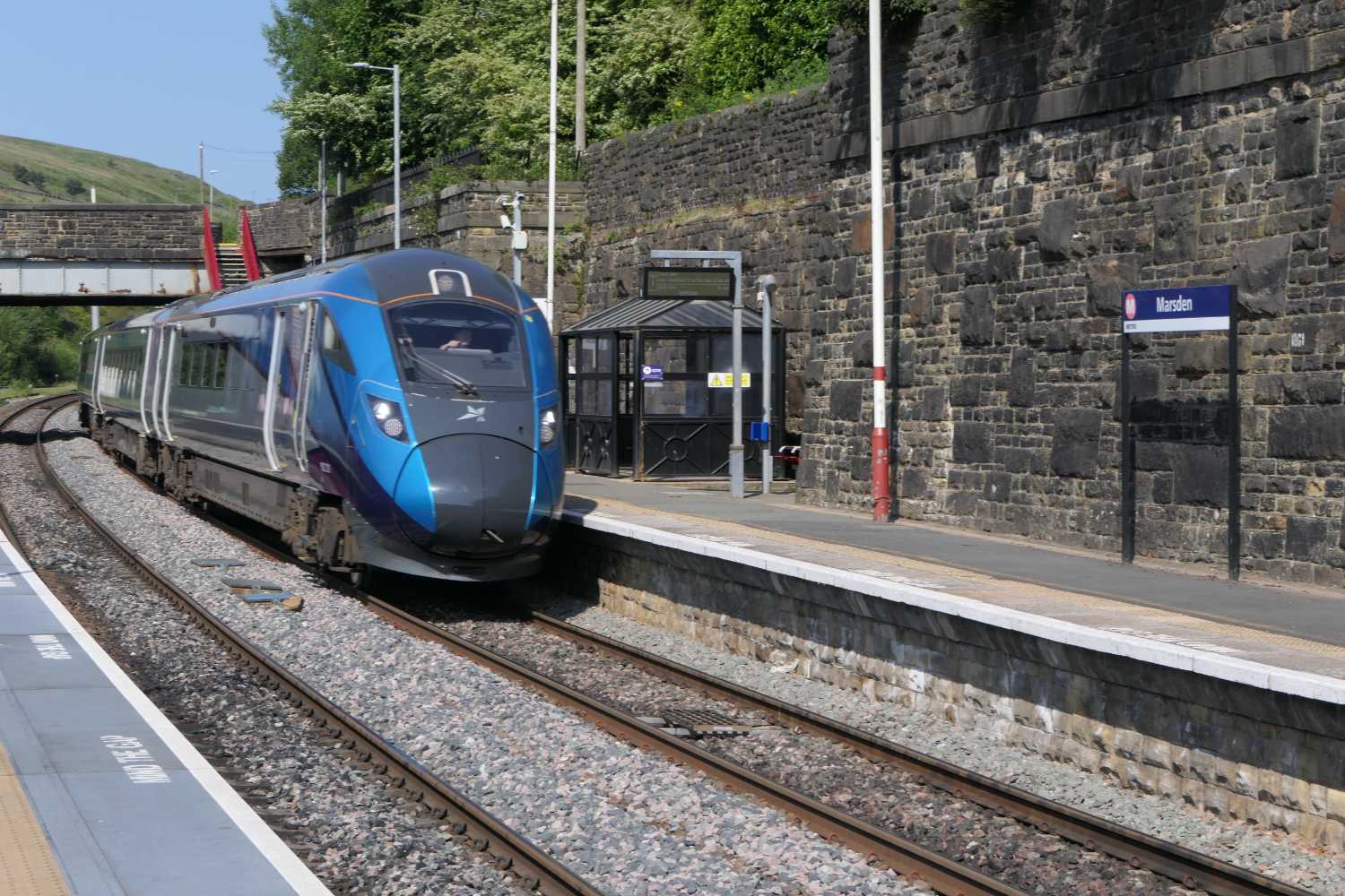 Train passing through Marsden Railway station.