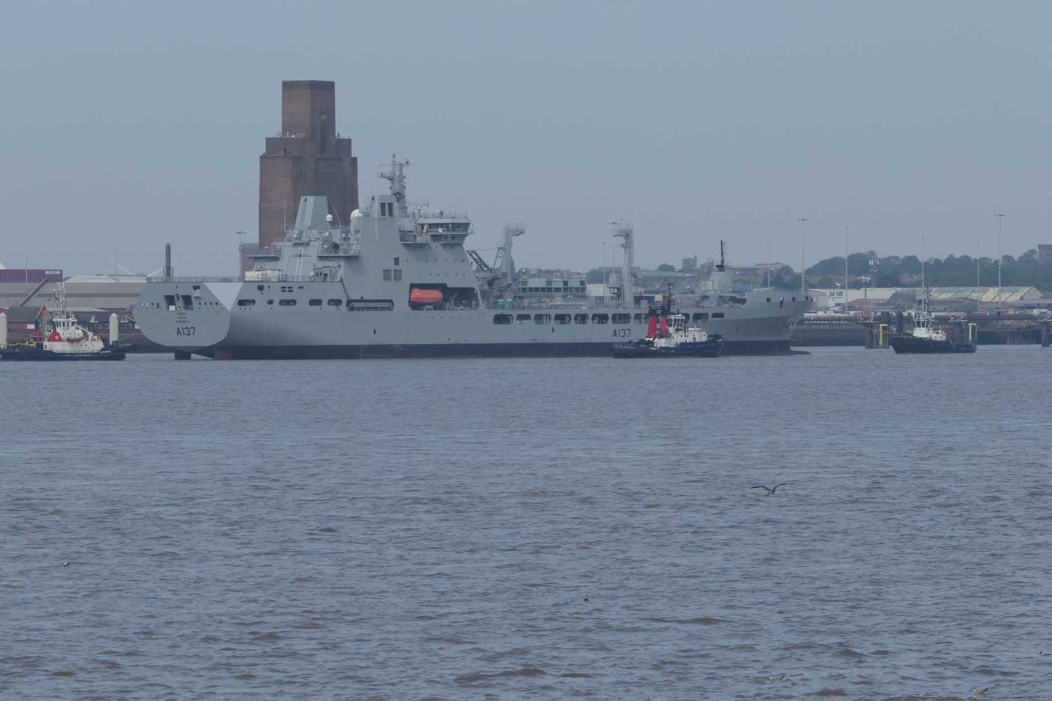 RFA Tiderace (A137) being towed one the mersey passing Birkenhead