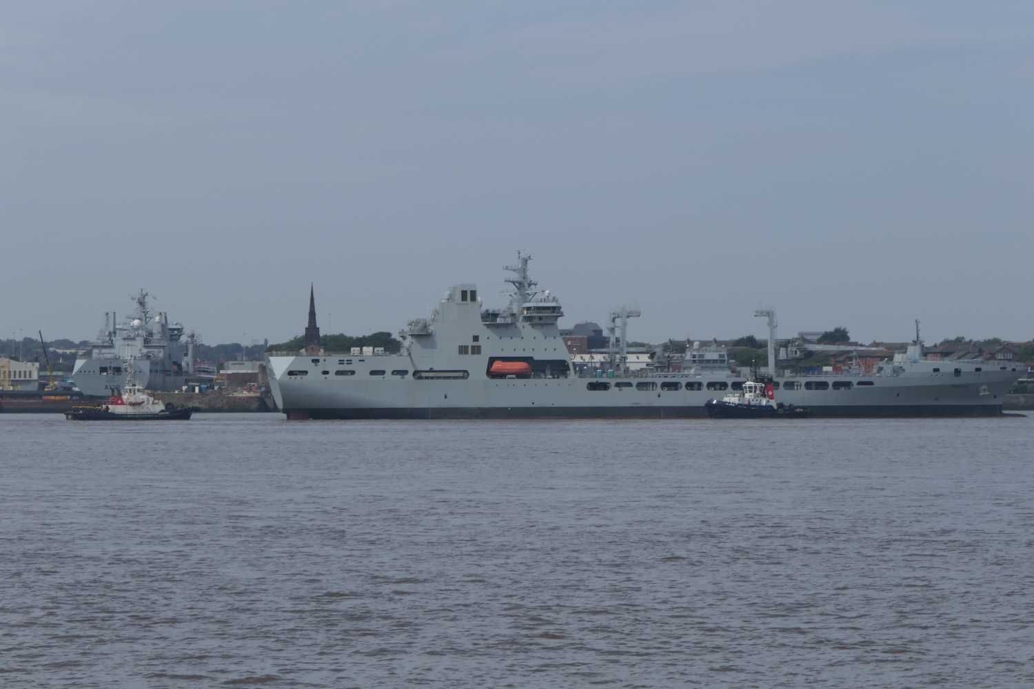RFA Tiderace (A137) being towed on the mersey adjacent to RFA Tidesurge (A138)