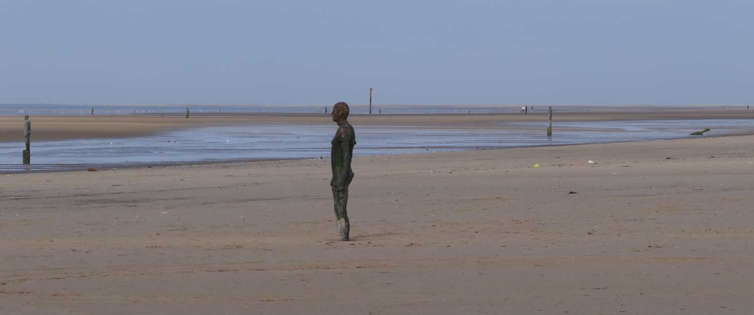 Gormley statues watching the ship.