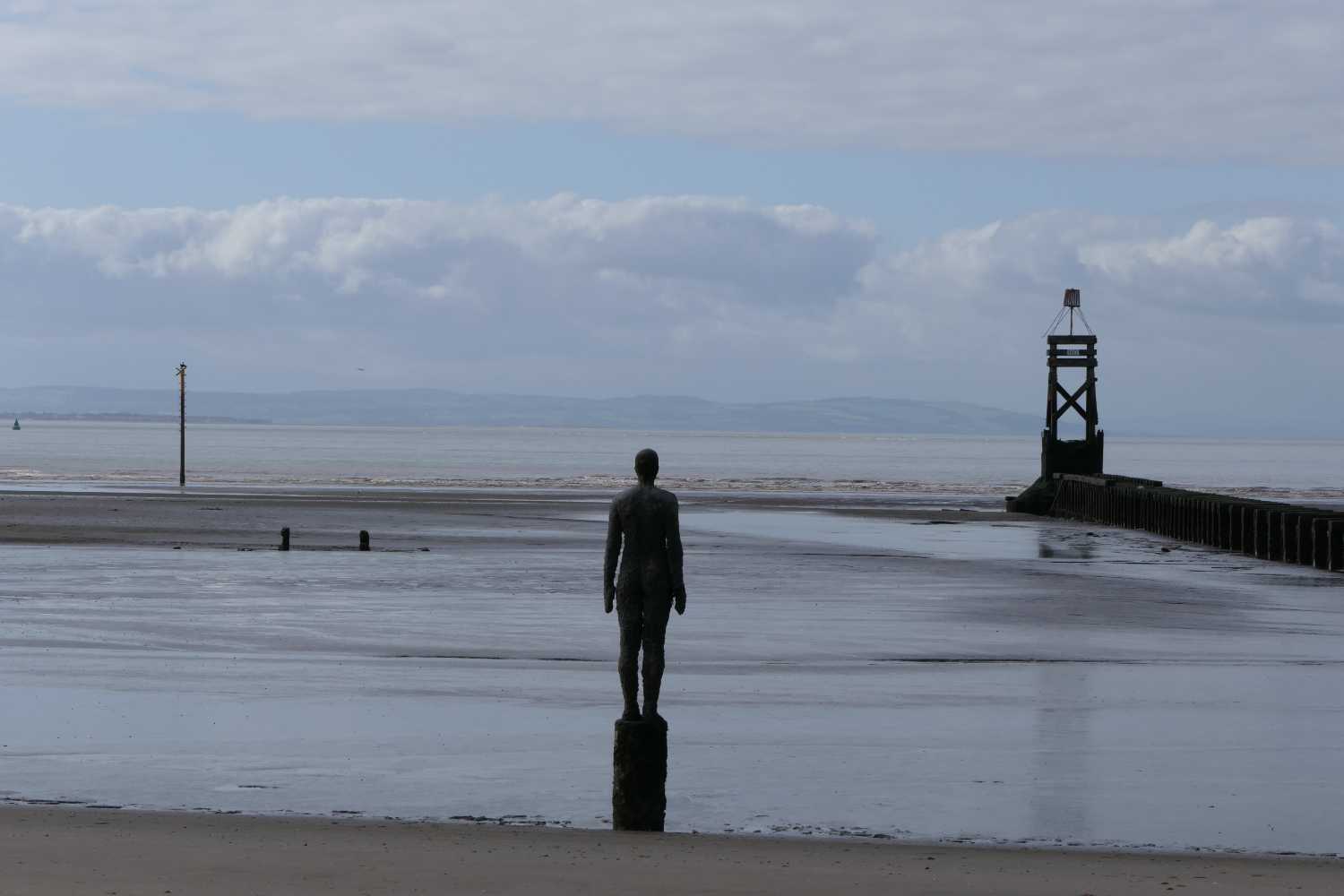 Gormley statue looking over twoards North Wales.