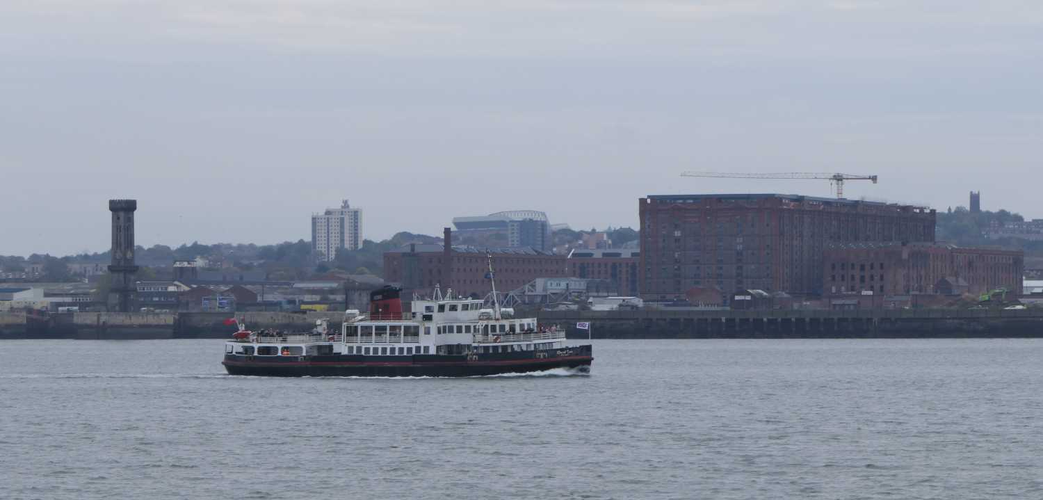 Roral Iris ferry between the Victoria Tower and the Tobacco Warehouse.
