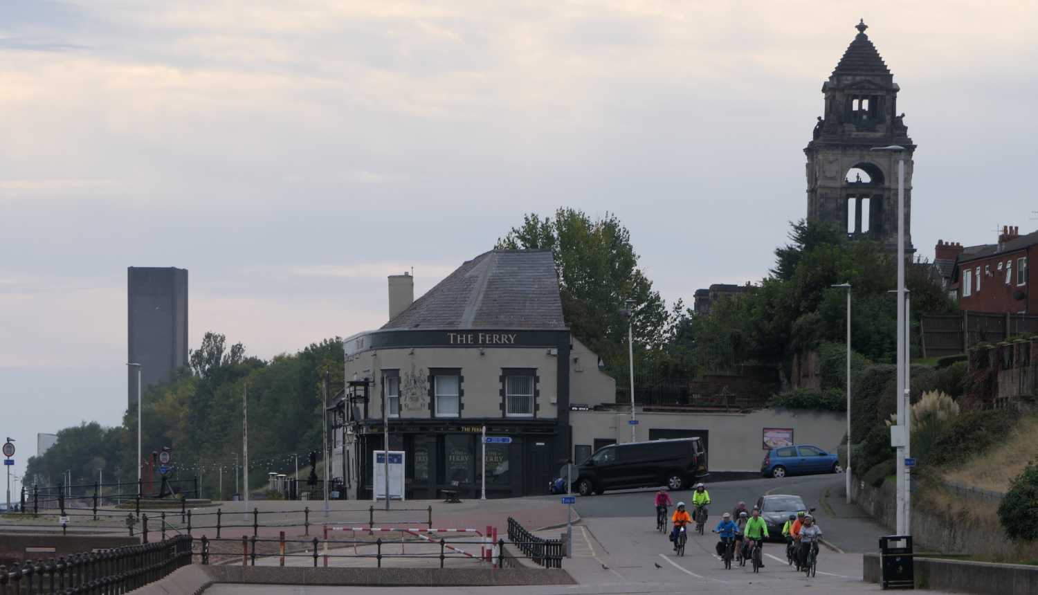 Cyclists passing the Ferryr Inn at Seacombe.