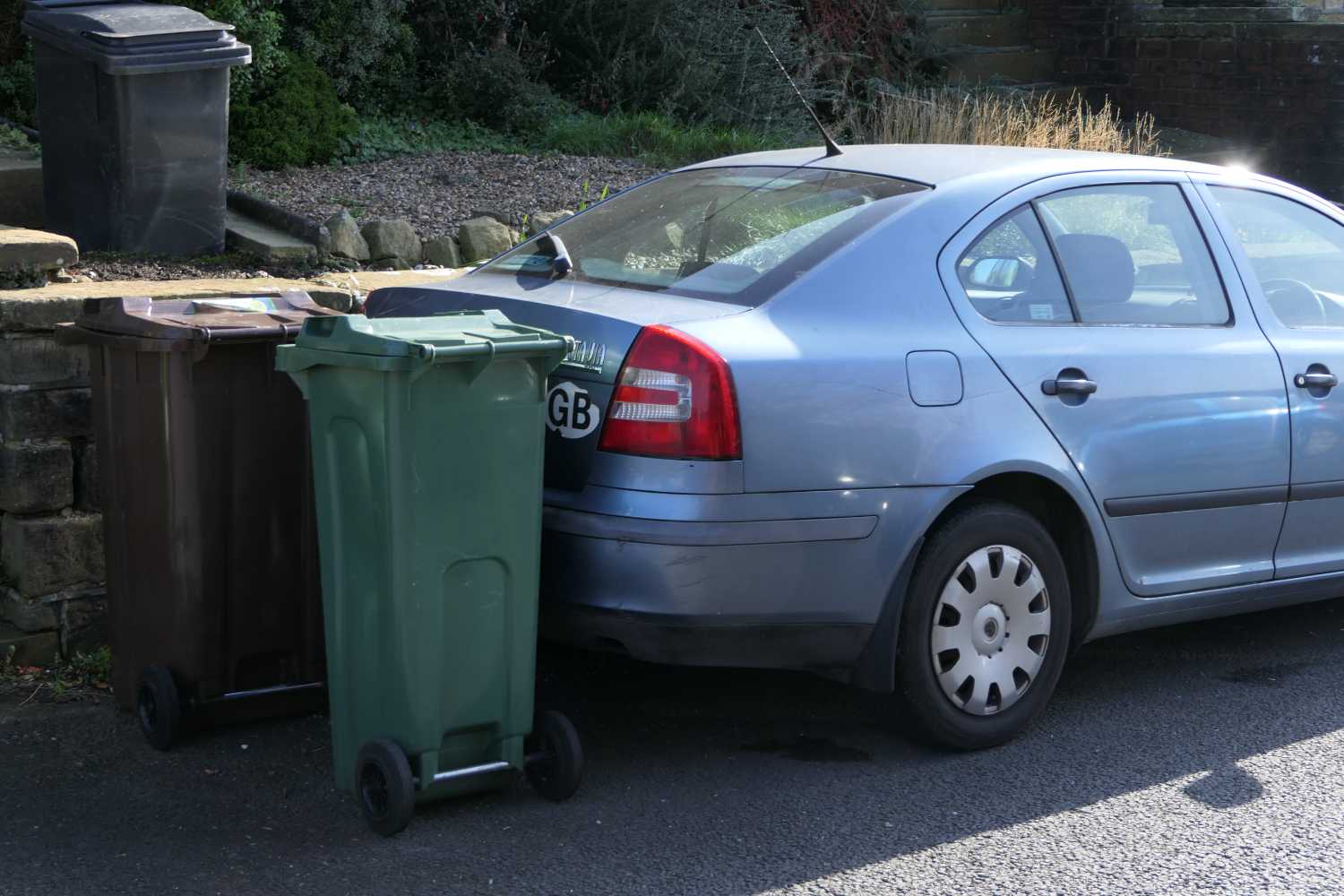 Brown bin outside house, two