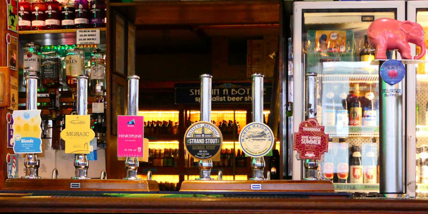 Ship and Mitre bar showing hand pumps